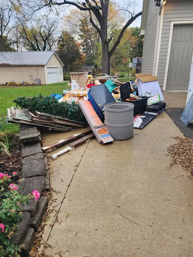 Dumpster being loaded with debris for Commercial Dumpster Rental in Kerrville